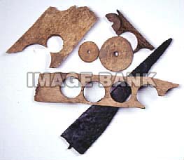 RWb62-American bone buttons and die cutter excavated from an American campsite.